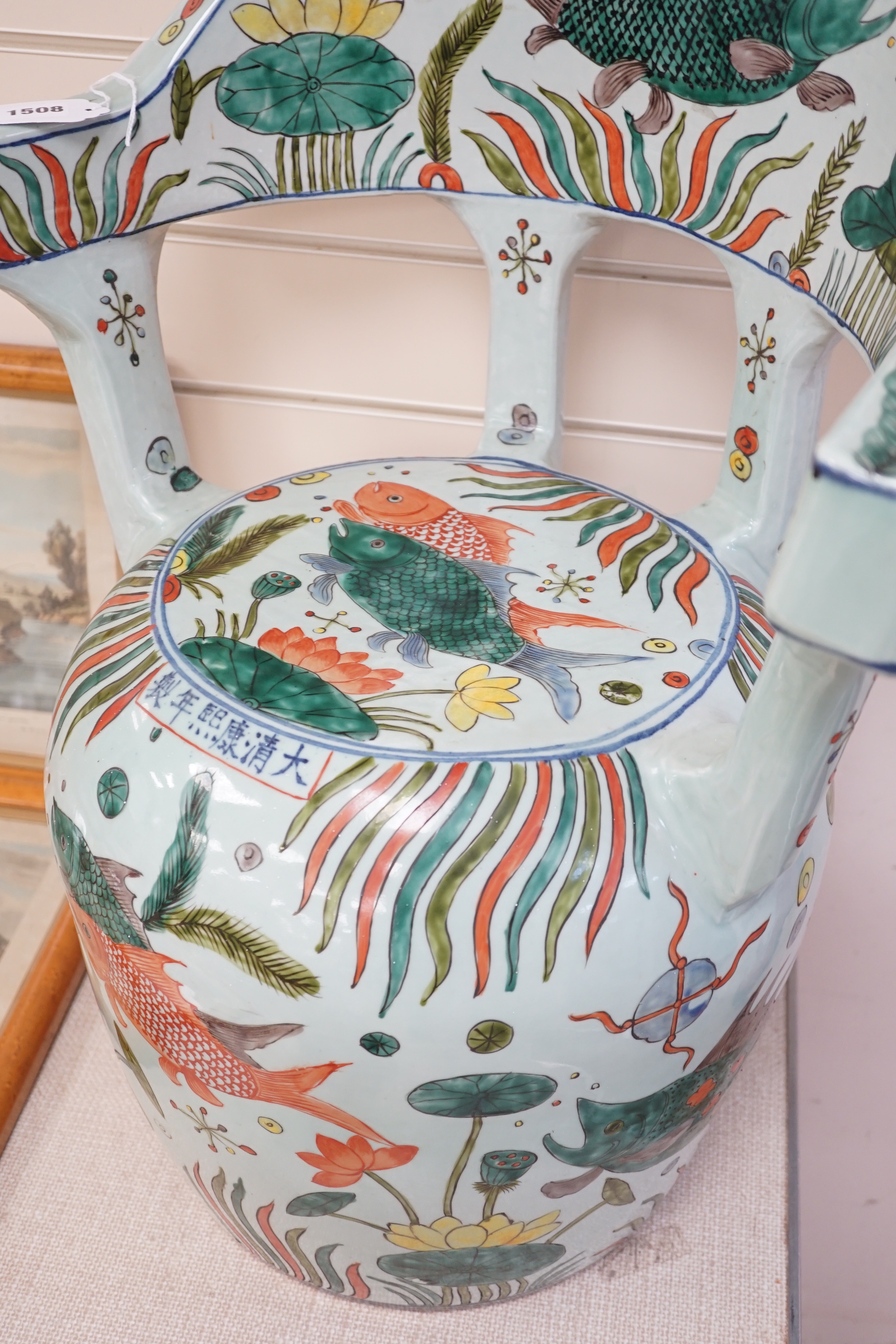 A Chinese famille verte porcelain ‘fish pond’ garden seat, 65cm high